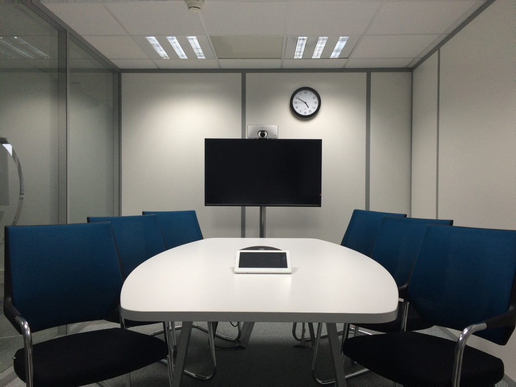 An empty conference room to visualise a teleconference.