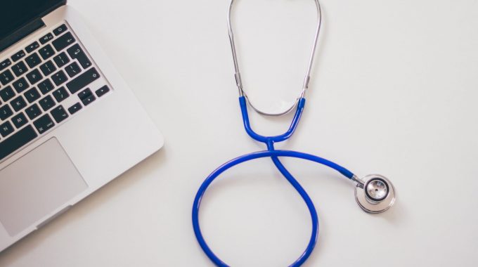 Stethoscope on desk to represent publich health.