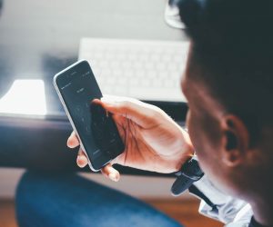 A man holds a phone.