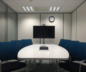 An empty conference room to visualise a teleconference.